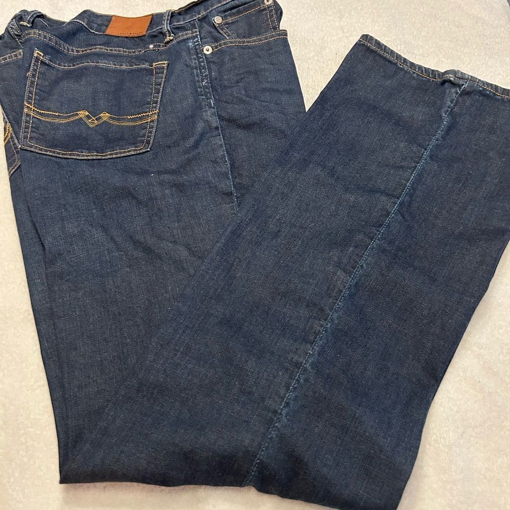 Lucky Brand Dark Blue Jeans with Brown Patch size 14